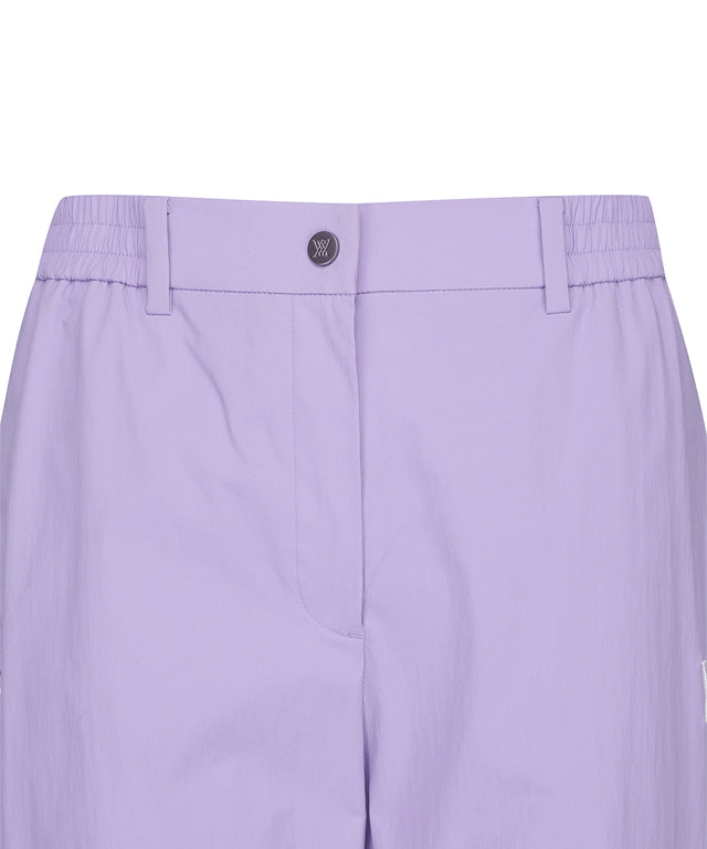 Lavender ANEW Golf Women Ventilation Slim Jogger Long Pants showcasing stylish design and comfortable fit.